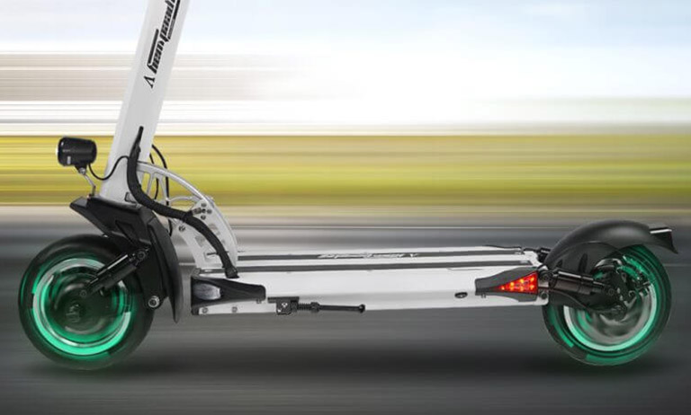 Speedway 5 electric scooter on the move – dual motors with green glowing wheels in motion