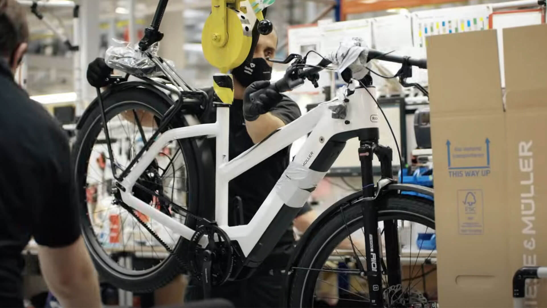 Riese & Müller electric bike at the factory – video thumbnail showing an e-bike in the Riese & Müller production facility.