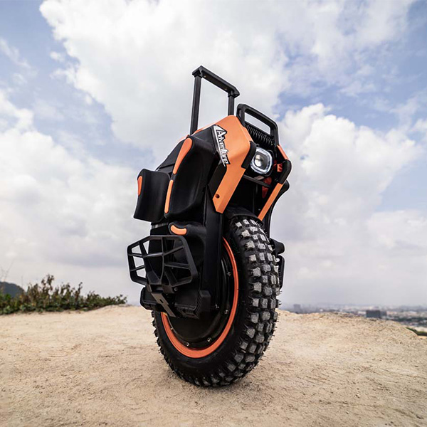 Close-up view of the Inmotion V14 electric unicycle on a dirt surface.