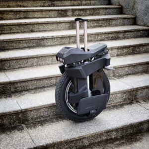 Side view of the Begode T4 electric unicycle standing on stair steps.
